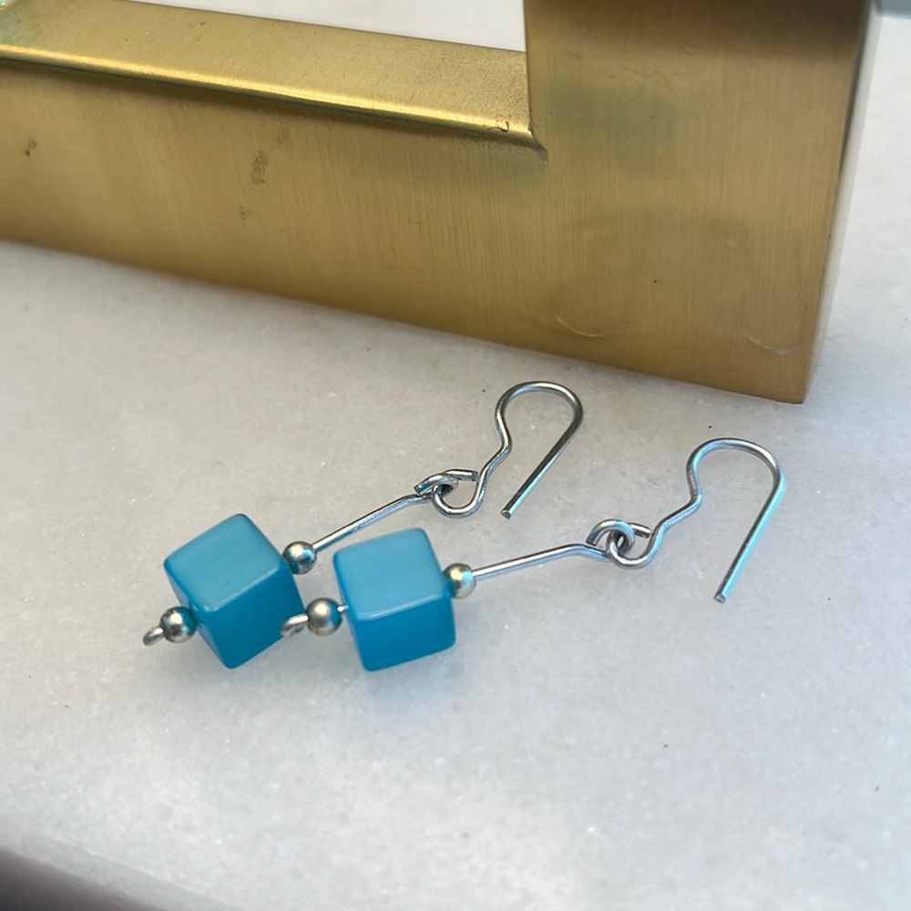 Beautiful handmade drop earrings with blue glass accent